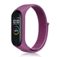 Nylon weave watch band with purple-magenta strap for fitness tracker, purple display case.