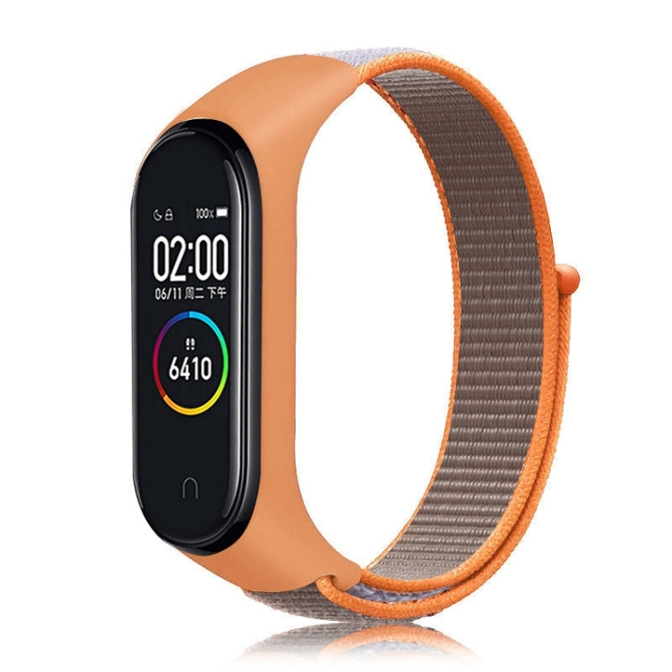 Nylon weave watch band for Xiaomi Mi Band 7 in orange with brown woven strap