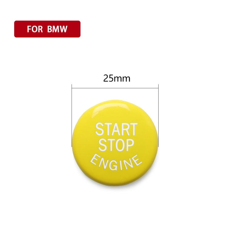 Round yellow engine start/stop button with START STOP ENGINE text