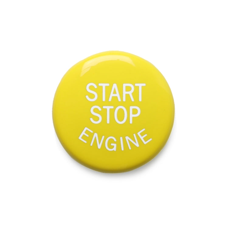 Close-up yellow START STOP ENGINE engine start/stop button
