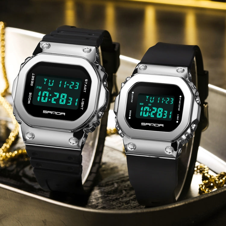 Two silver digital dual-display sport watches with glowing green screens