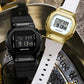 Black and gold digital dual-display sport watches side by side