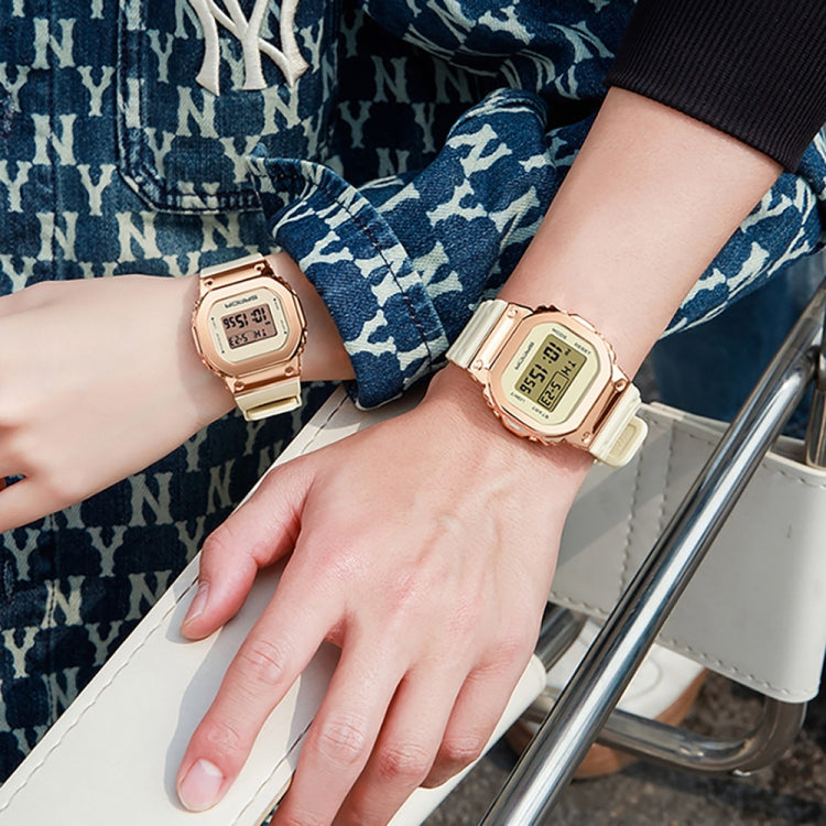 Two wrists wearing small digital dual-display sport watches with backlit screens