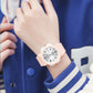 Light pink TPU strap waterproof electronic watch with white dual-calendar dial on wrist