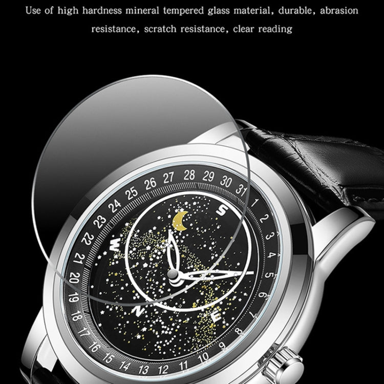 Close-up of black luminous dial mechanical watch with black leather strap and steel case.