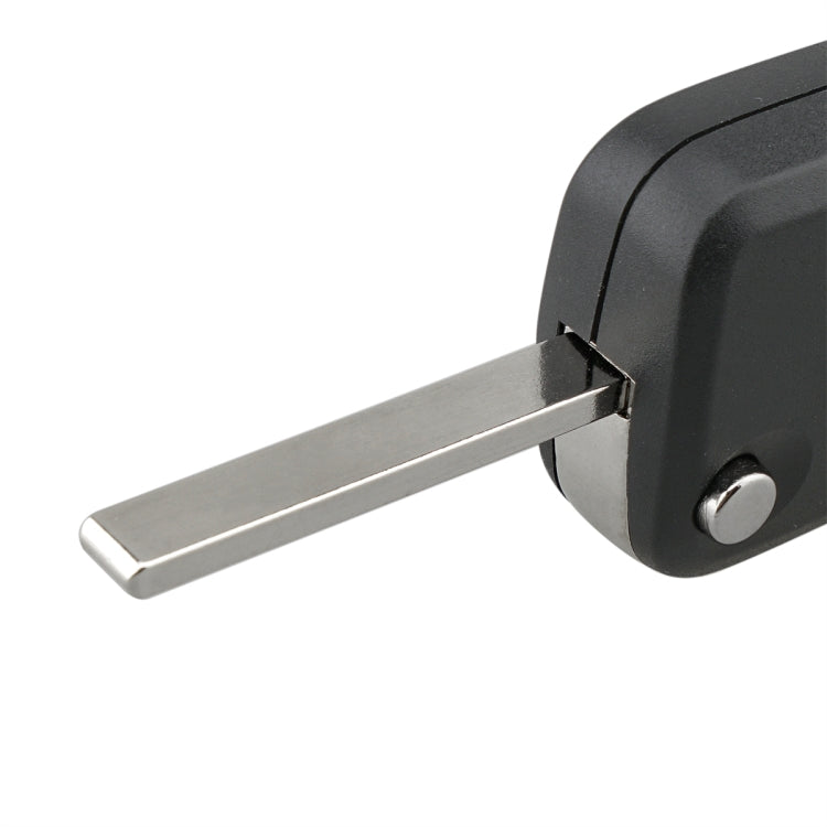 Foldable key blade insert, silver metal blade extending from dark gray key case