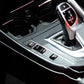Black gear buttons on car center console near gear shifter, SPORT/ECOPRO/OFF/P icons