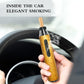 Timber-log cigarette holder with metal cap and black insert, held by hand