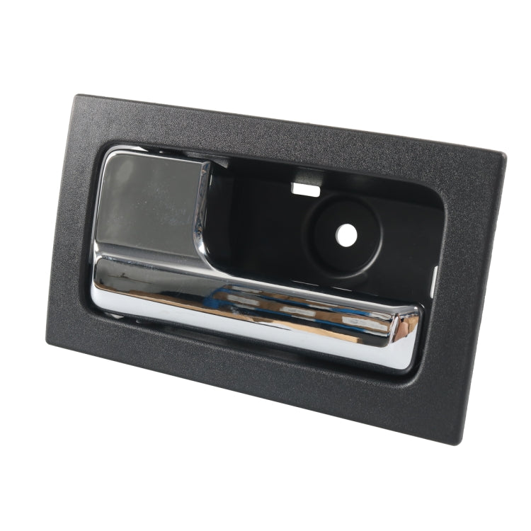 Left front interior door handle, black bezel with chrome lever and circular insert
