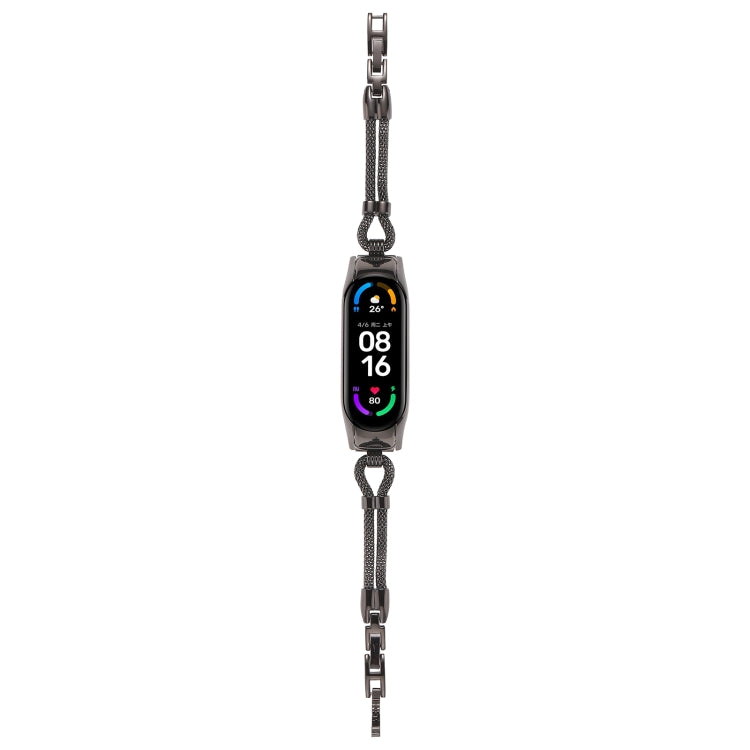 Dark metal watch band with curb-link chain and rectangular smartwatch tracker, front view.