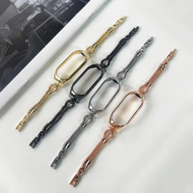 Assorted metal watch bands with mesh links in gold, black, rose, and silver, multiple sizes.