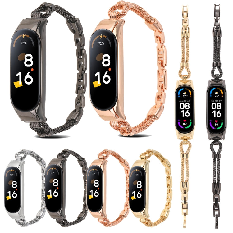 Assorted metal watch bands with rectangular smartwatch trackers in silver, black, rose, and gold.