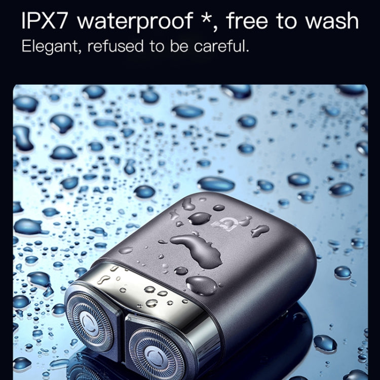 Electric shaver with water droplets on dark body for wet-use