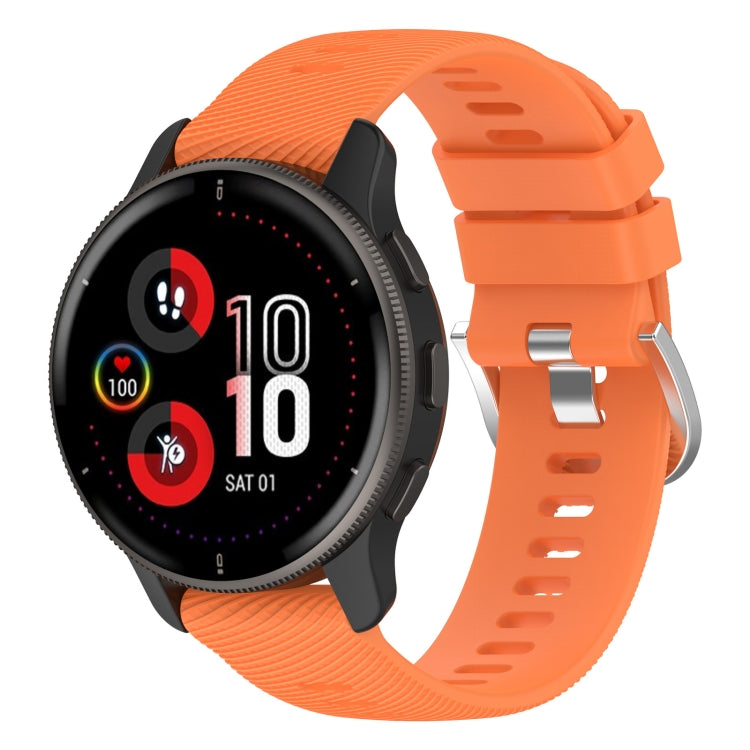 Orange silicone watch band with cross-textured finish and clasp hardware