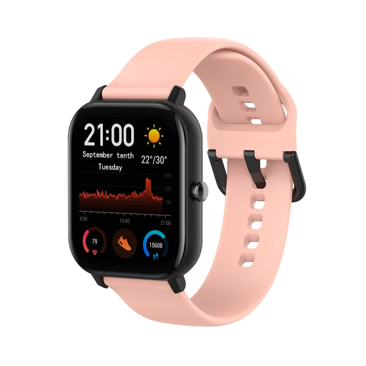 Light pink soft silicone smartwatch band with adjustable holes and clasp.
