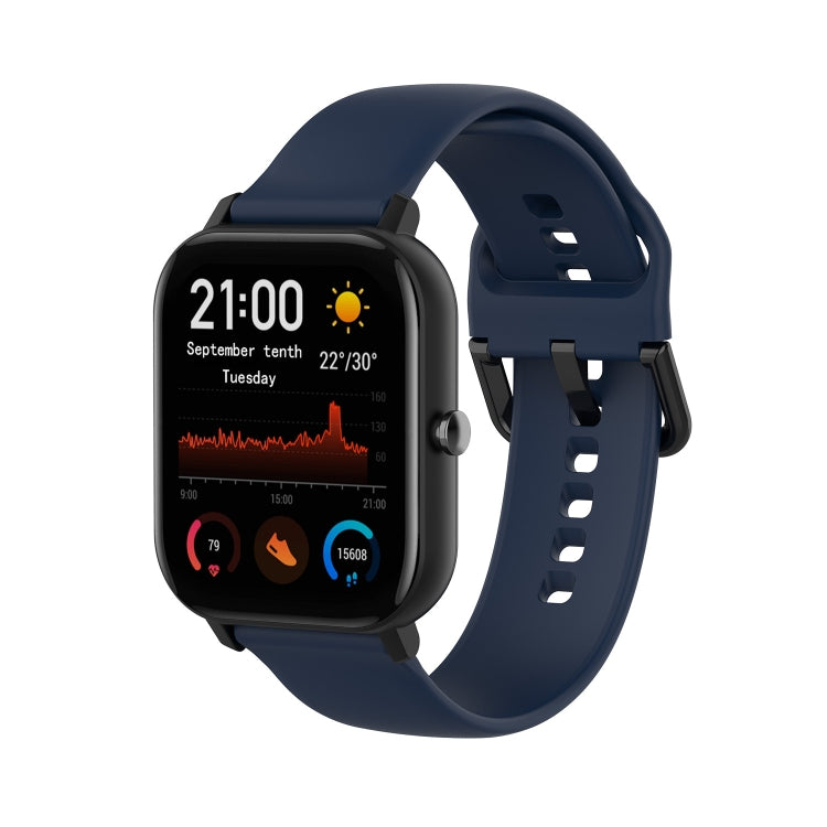 Midnight blue soft silicone smartwatch band with adjustable holes and clasp.