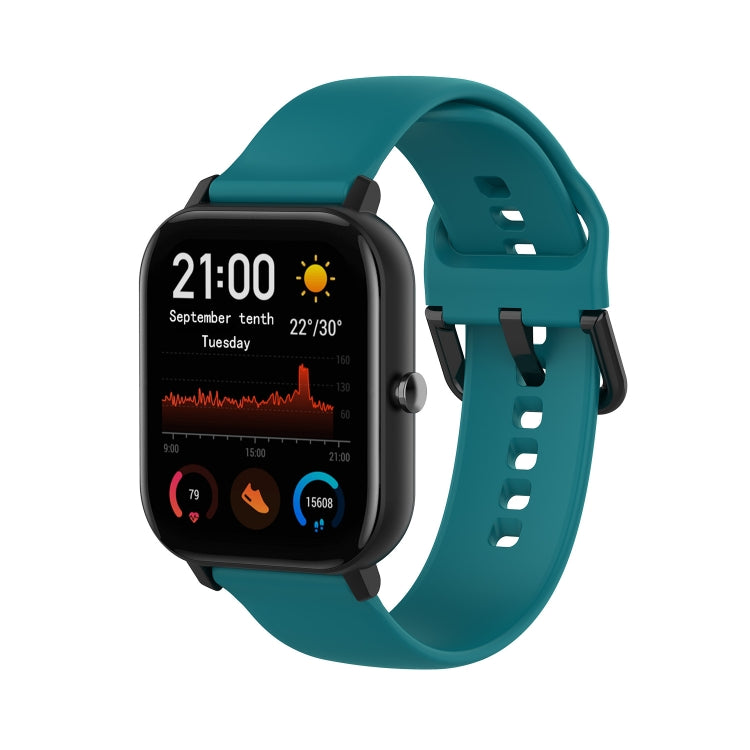 Teal soft silicone watch band with perforated holes and buckle clasp