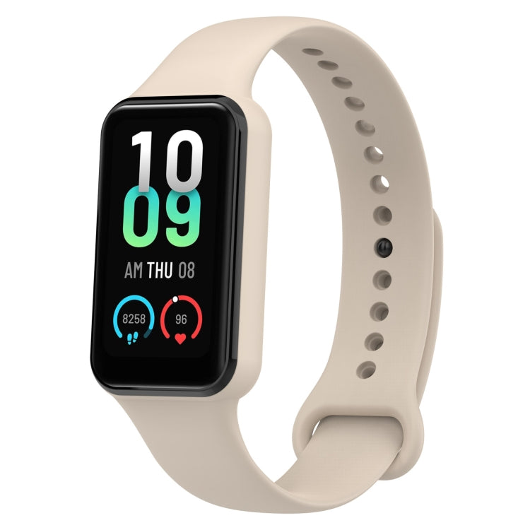 Light beige silicone watch band with perforated strap and black smartwatch face