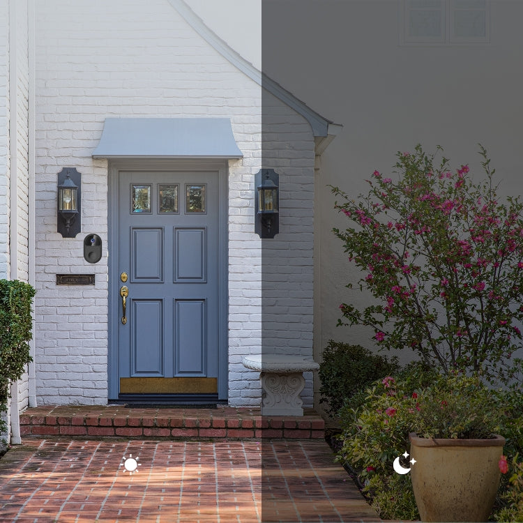 Outdoor black mini smart video doorbell mounted beside a front door