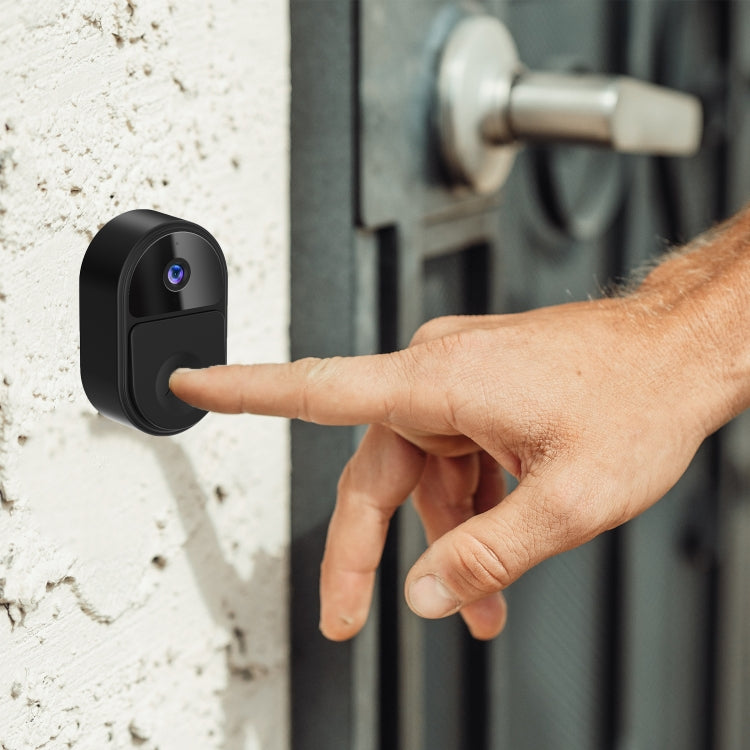 Black mini smart video doorbell with finger pointing at the face button
