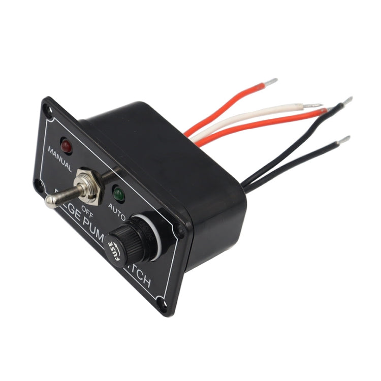 Black bilge pump switch panel angled view with AUTO knob and green indicator