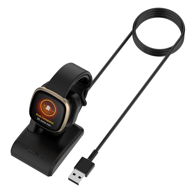 Black magnetic watch charger holder with glowing charging indicator and USB cable