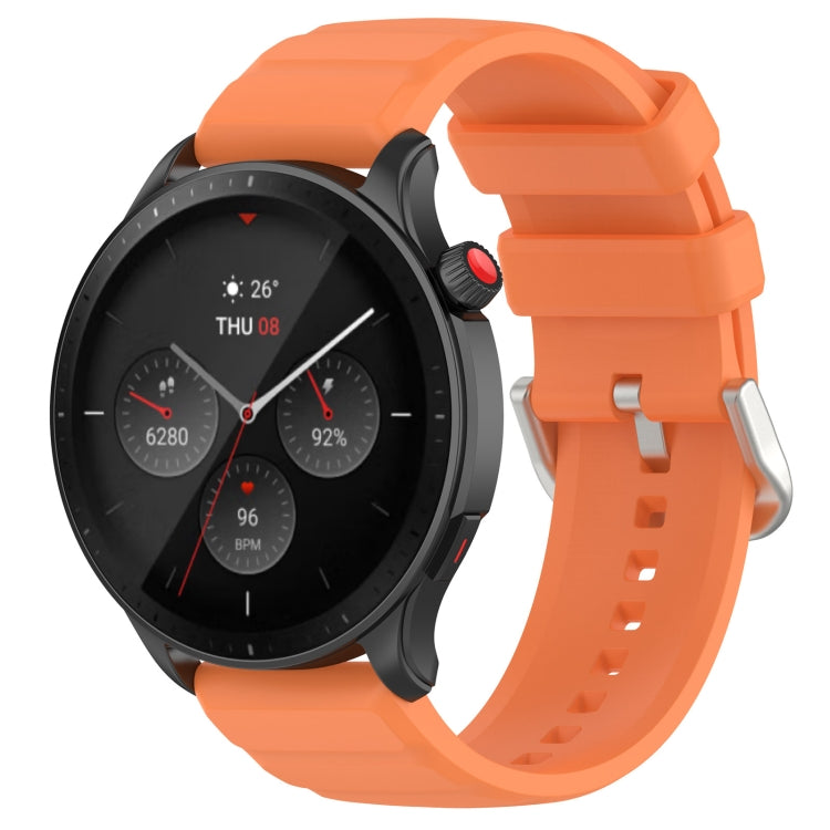 Orange silicone watch band with metal buckle and adjustment holes