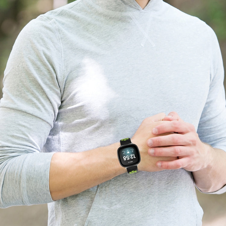 Silicone watch band with dual-tone design, black strap and light accent segments