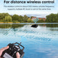 Black RC remote control with antenna in hand, wireless bait boat operation