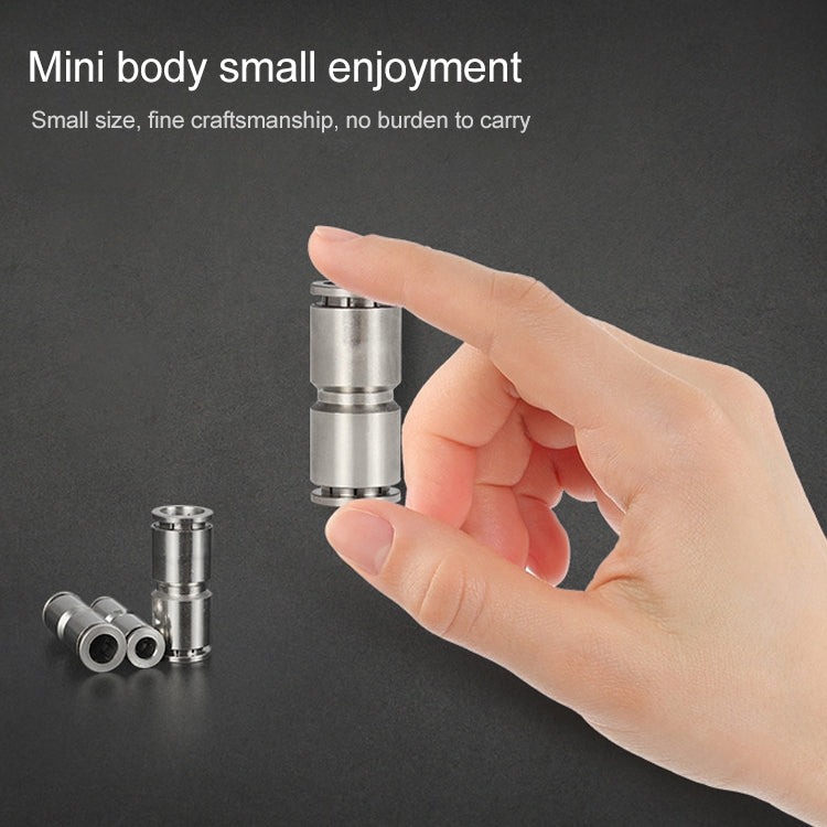 Small nickel plated copper pneumatic quick fitting connector held in hand