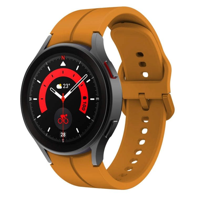 Orange silicone watch band with buckle and multiple adjustment holes