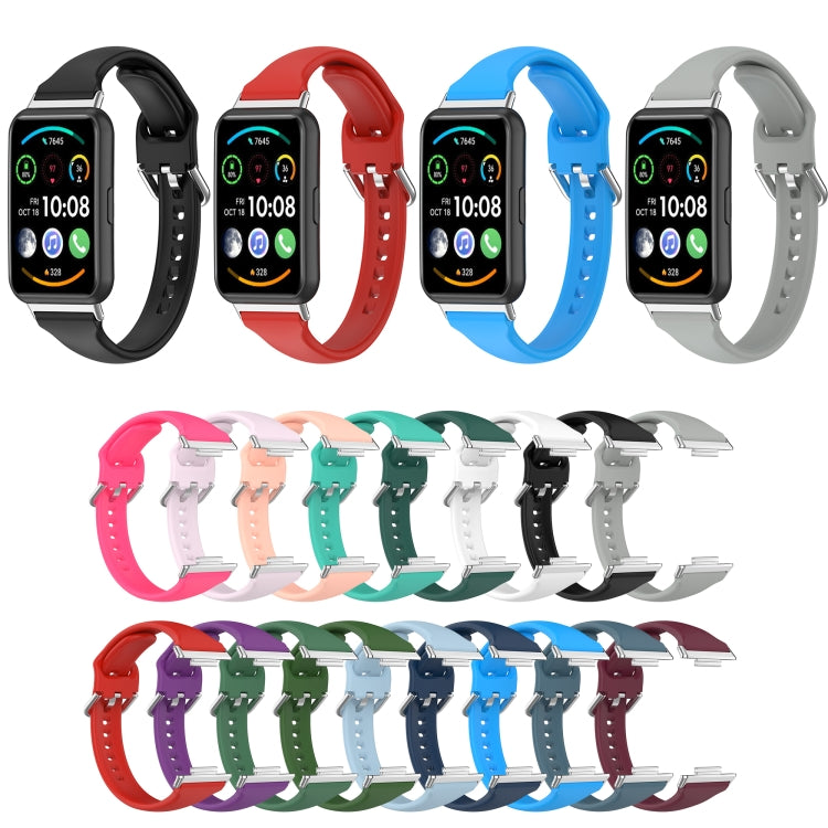 Multiple silicone smartwatch bands in assorted colors with metal buckles and perforated straps.