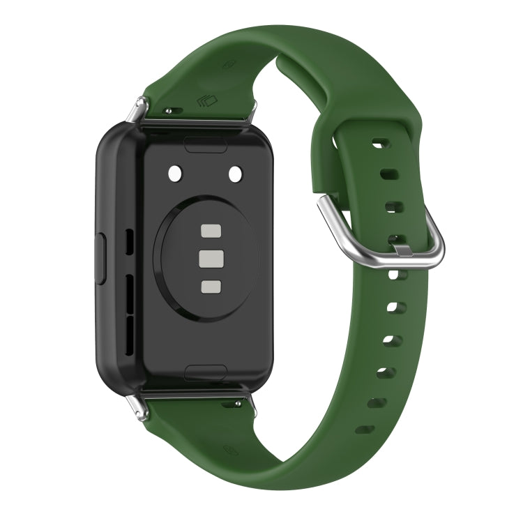 Green silicone watch band with metal clasp and adjustment holes (back view).