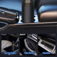 Handheld vacuum cleaner shown with car storage mounts like cup holder, door pocket, and glovebox.