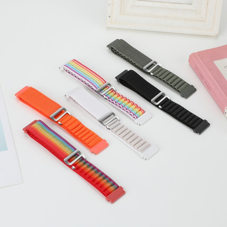 Universal nylon loop watch bands laid out in rainbow, orange, black, and red colors
