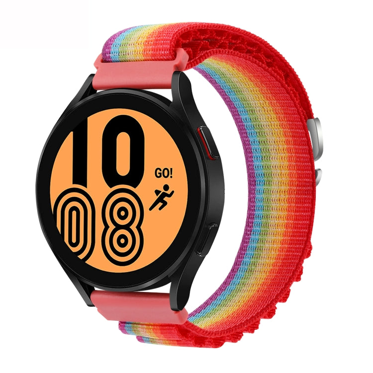 Rainbow nylon loop watch band with metal buckle, shown with a smartwatch face