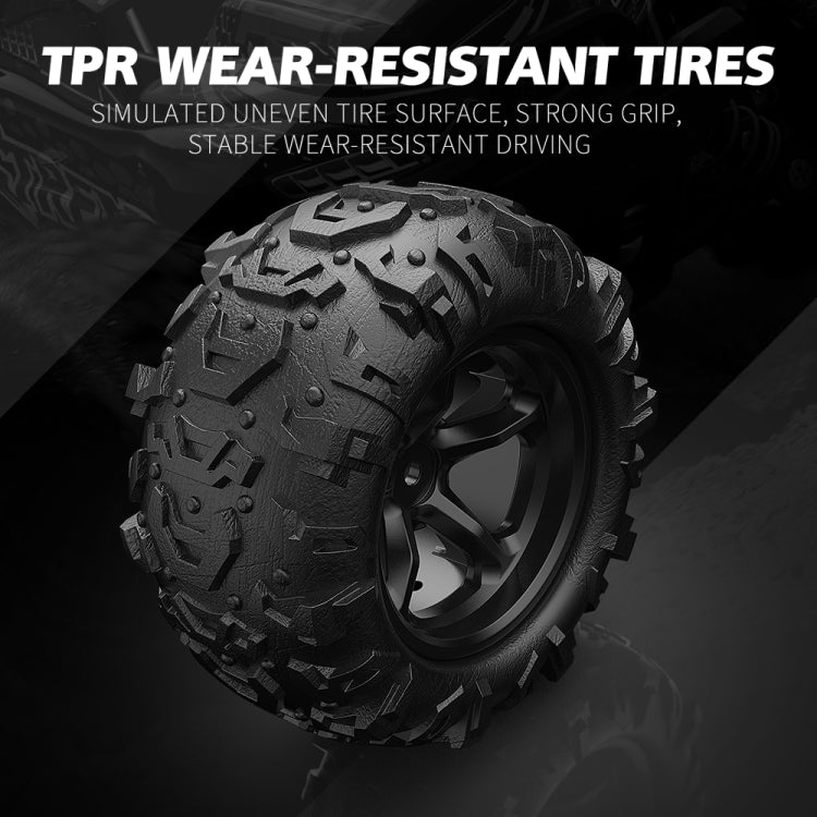 All-terrain RC tire with deep tread and black wheel, close-up
