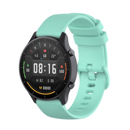 Teal 22mm silicone watch strap with textured plaid pattern and buckle holes.