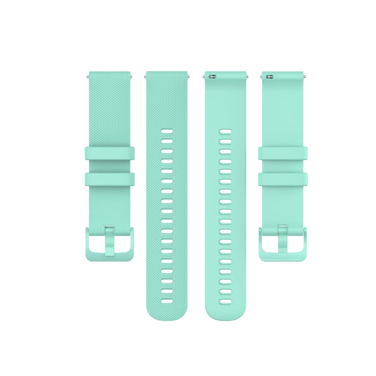 Teal 22mm silicone watch straps showing textured front and back with pin buckle.