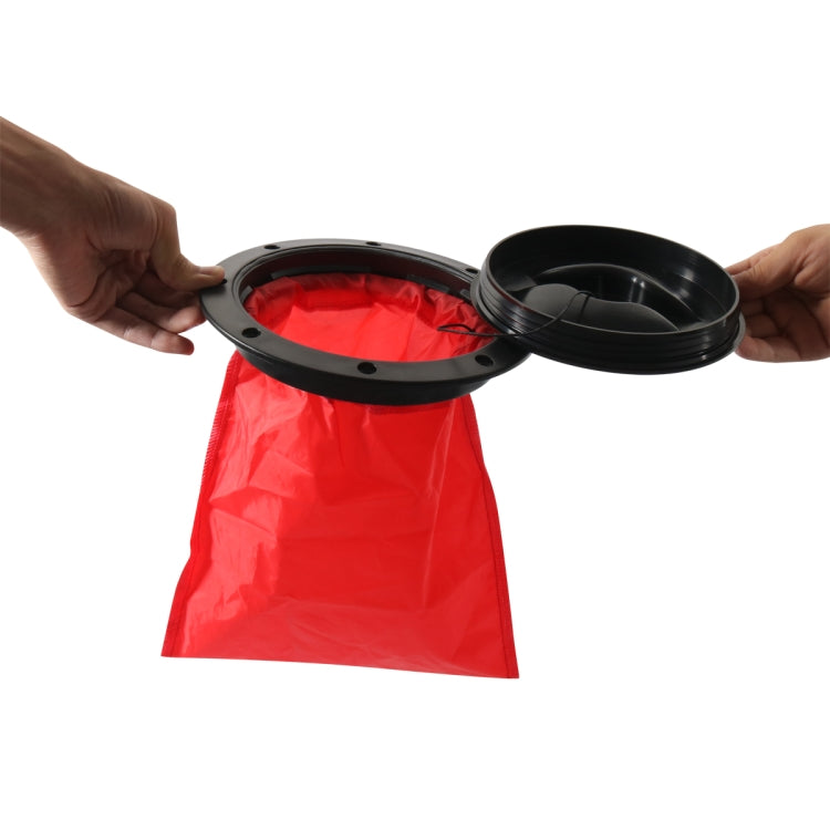 Hands lifting black open hatch cover, revealing red mesh pocket inside