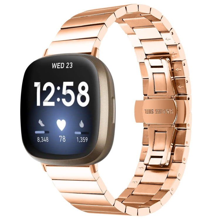 Rose gold metal link watch band with butterfly buckle clasp and smartwatch attached