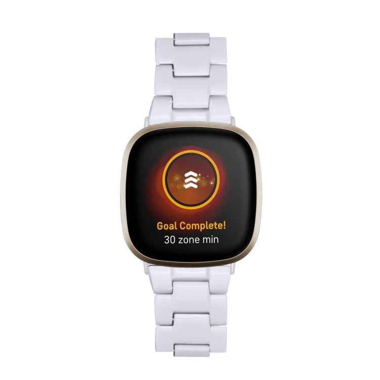 White resin watch band with butterfly clasp attached to smartwatch