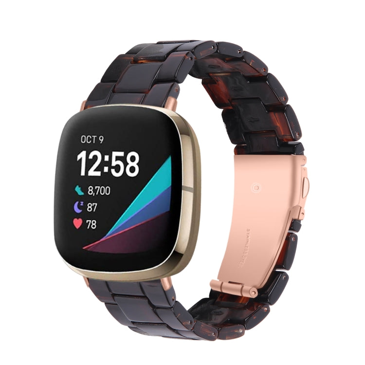 Universal resin watch band with dark tortoise links and pale pink strap section, smartwatch shown