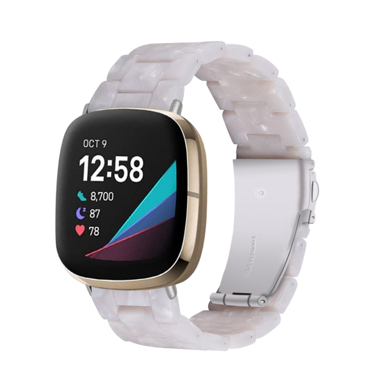 Transparent white resin link watch band with molded pattern, angled view on smartwatch