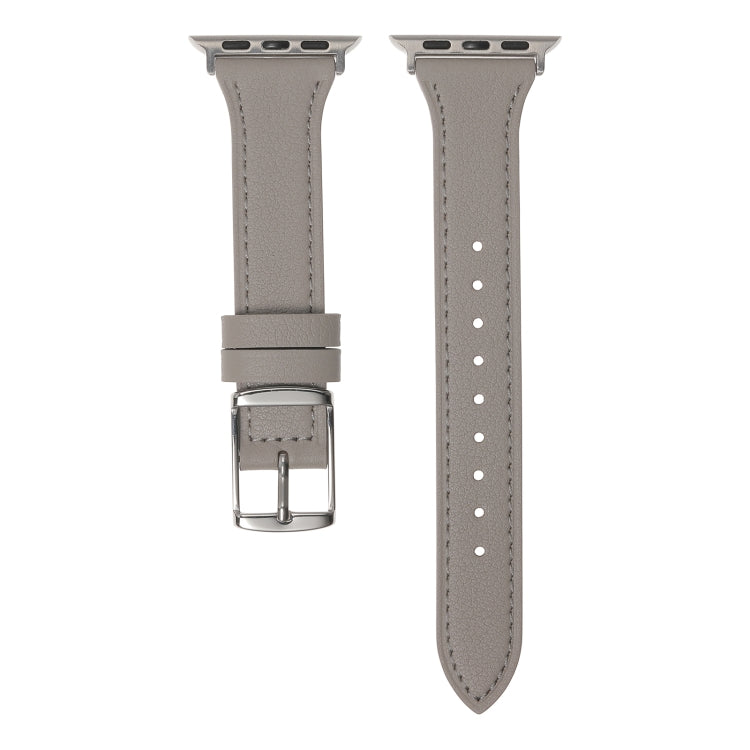 Light grey leather watch band with silver buckle and row of adjustment holes