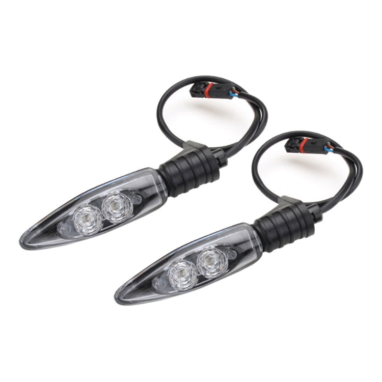 Pair of clear-lens LED motorcycle rear turn signal lights with black wiring harness