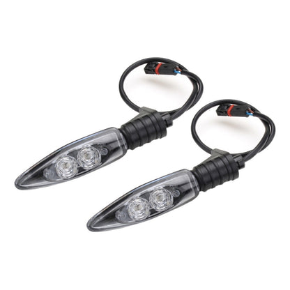 Pair of clear-lens LED motorcycle rear turn signal lights with black wiring harness