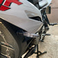 Clear-lens LED rear turn signal light on a motorcycle front-side view