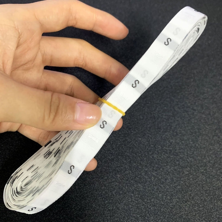 Polyester size label strip, white with repeated “S” print and stitched edge