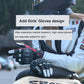 Motorcycle leather gloves worn on a rider’s hands, black with red and white panels